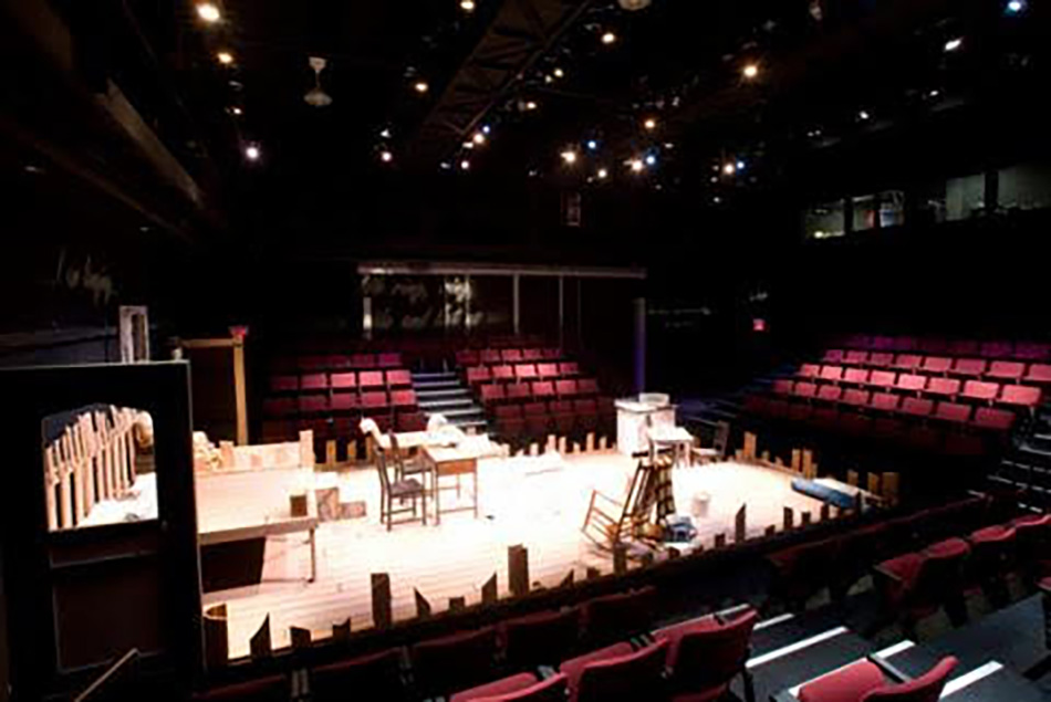Interior photo of Madden Theatre stage and seating.